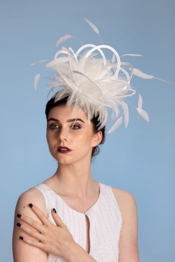 white satin loop and feather fascinator hat set on a headband white satin loop and feather fascinator hat set on a headband