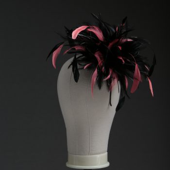 Ladies wedding or races black and coral pink small feather and satin loop fascinator hat