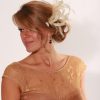 Cream small sinamay and feather fascinator hat