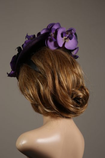 Aubergine sinamay saucer fascinator hatinator hat with purple and black orchid flowers