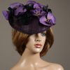 Aubergine sinamay saucer fascinator hatinator hat with purple and black orchid flowers