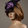 Aubergine sinamay saucer fascinator hatinator hat with purple and black orchid flowers