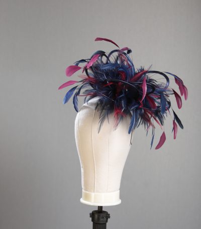 Ladies' formal Navy Blue and Burgundy Wine medium feather and satin loop fascinator hat. Suitable for a wedding or ladies' day at the races