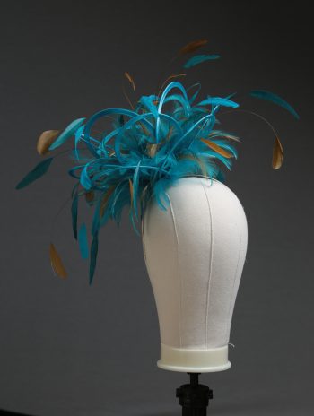 Ladies' formal Turquoise and Gold medium feather and satin loop fascinator hat. Suitable for a wedding or ladies' day at the races