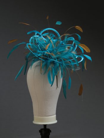 Ladies' formal Turquoise and Gold medium feather and satin loop fascinator hat. Suitable for a wedding or ladies' day at the races