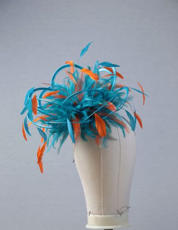 Ladies' formal Turquoise and Orange medium feather and satin loop fascinator hat. Suitable for a wedding or ladies' day at the races