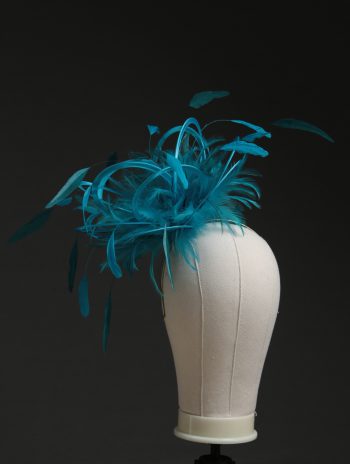 Ladies' formal Turquoise and Teal medium feather and satin loop fascinator hat. Suitable for a wedding or ladies' day at the races