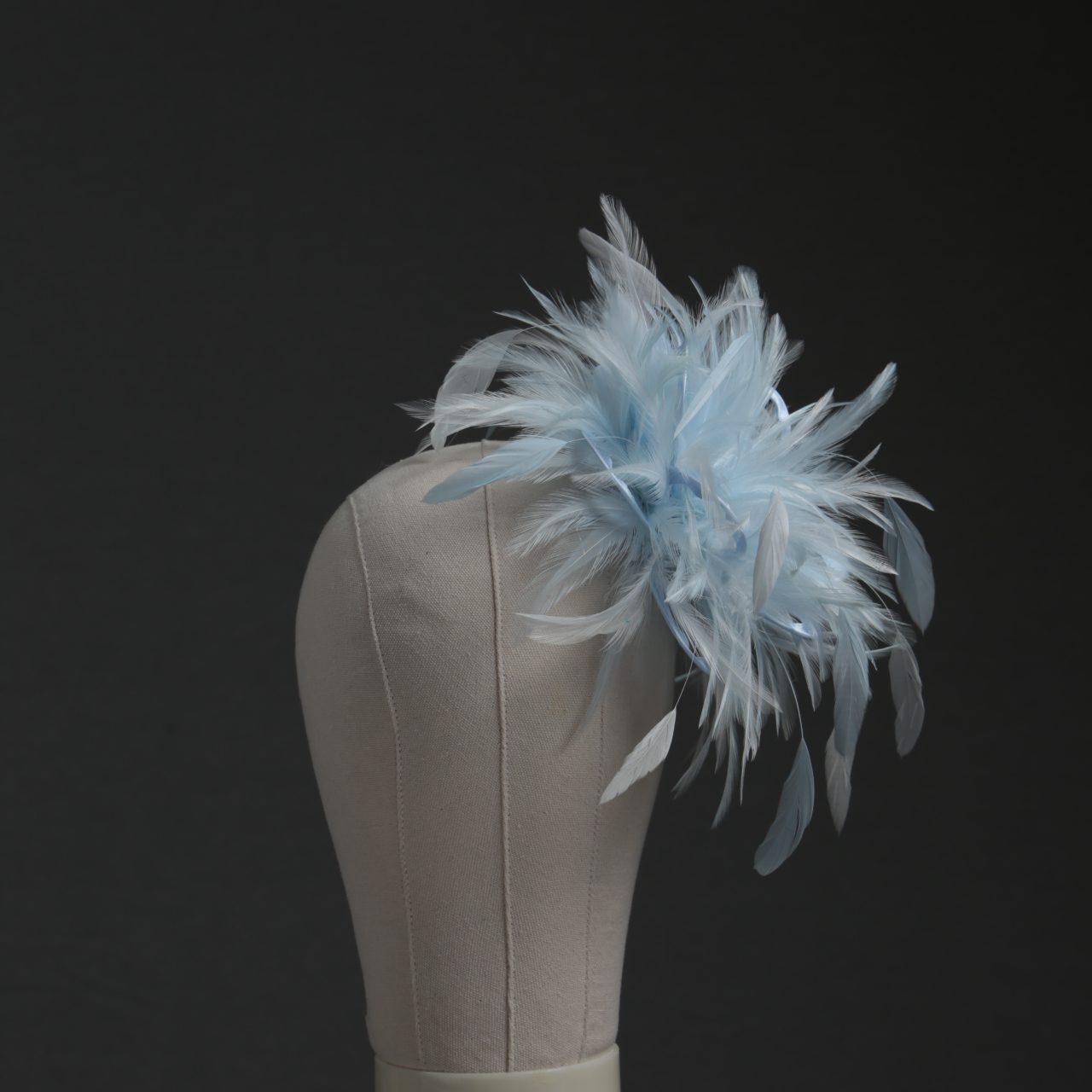 Ladies wedding or races baby blue and white small feather and satin loop fascinator hat