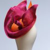 Hot Pink sinamay saucer hat set on a orange button pillbox fascinator