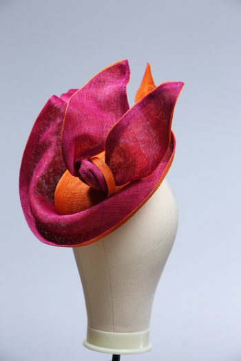 Hot Pink sinamay saucer hat set on a orange button pillbox fascinator