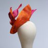 Hot Pink sinamay saucer hat set on a orange button pillbox fascinator