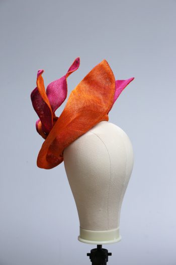 Hot Pink sinamay saucer hat set on a orange button pillbox fascinator