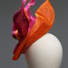 Hot Pink sinamay saucer hat set on a orange button pillbox fascinator