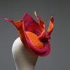 Hot Pink sinamay saucer hat set on a orange button pillbox fascinator