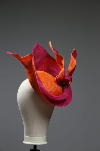 Hot Pink sinamay saucer hat set on a orange button pillbox fascinator