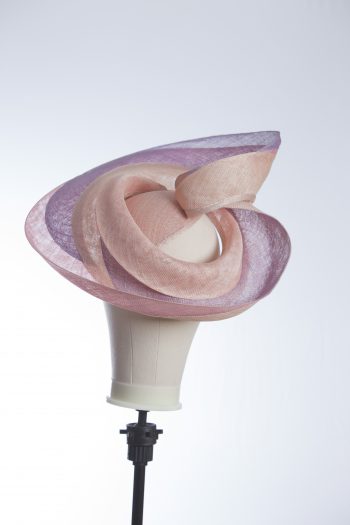 Pink lilac and oyster sinamay swirl fascinator hat set on a teardrop base