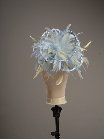 Ladies formal Baby blue and yellow medium feather and satin loop fascinator hat. Suitable for a wedding or ladies day at the races