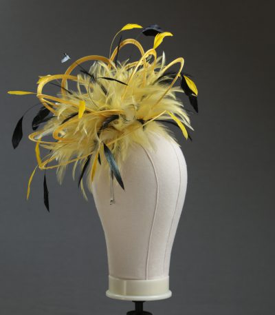 Ladies formal yellow and black medium feather and satin loop fascinator hat. Suitable for a wedding or ladies day at the races