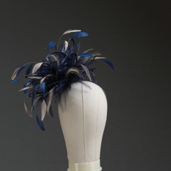 Ladies' formal Navy Blue and Taupe Nude medium feather and satin loop fascinator hat. Suitable for a wedding or ladies' day at the races