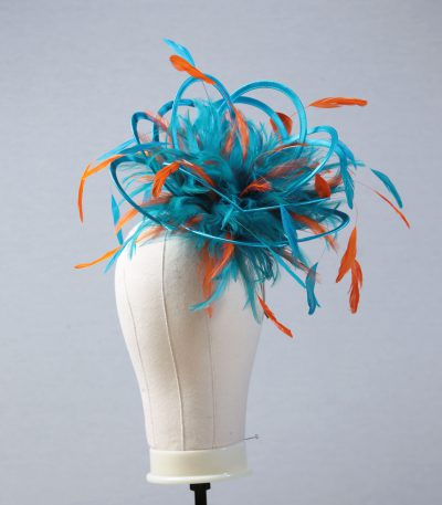 Ladies' formal Turquoise and Orange medium feather and satin loop fascinator hat. Suitable for a wedding or ladies' day at the races